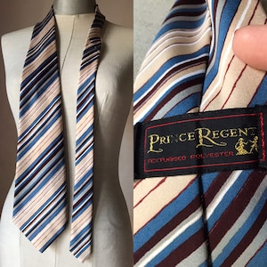 70s vintage striped “bell” necktie in airport bleu and beige hues by Prince Regent, UK