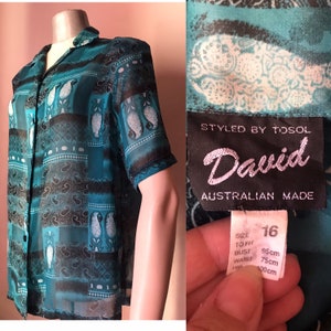 Petrol green sheer 80s buttoned shirt with shoulder pads and bold paisley pattern made in Australia. XL size