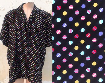 Dotty 80s vintage unisex, loose buttoned blouse features colorful polka dot pattern on black fond. Made in Italy
