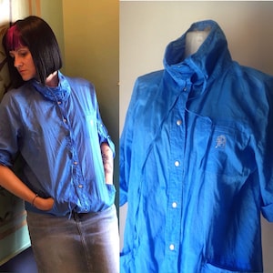 Lightweight 80s vintage snap buttoned, casual, baggy fit, windbreaker jacket in electric blue