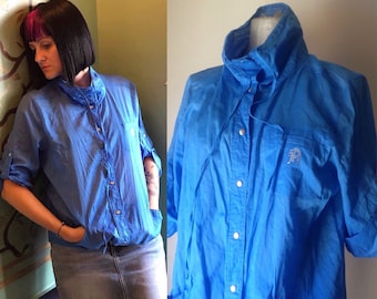 Lightweight 80s vintage snap buttoned, casual, baggy fit, windbreaker jacket in electric blue