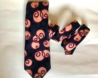 Salmon pink round prints on black canvas 70s vintage wide, trevira polyester necktie made in Athens, Greece by Motivo, found unworn