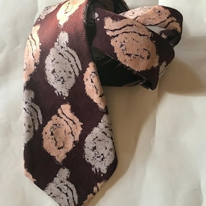 The widest 70s necktie! groovy, bell bottom, trevira brown cravate features textured designs like flowers by Commodore