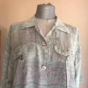Mint green sheer loose buttoned shirt 1990s vintage, with floral, geometric, baroque prints and asymmetrical length