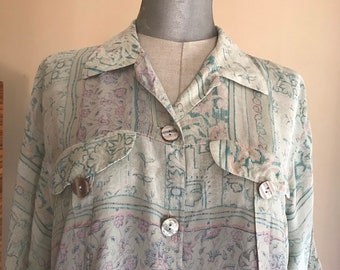 Mint green sheer loose buttoned shirt 1990s vintage, with floral, geometric, baroque prints and asymmetrical length