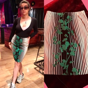 Novelty vertical striped 80s vintage straight line, body hugging, cotton skirt that features green/black floral print on the front