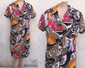 Fantastic psychedelic 60's half buttoned dress with pointed collars and bold swirl/floral designs in warm colors