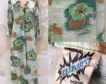 Robe longue vintage des années 70 avec audacieux et volants, encolure en V, plus de longues manches à volants et un beau motif de fleurs de pensée en vert/marron