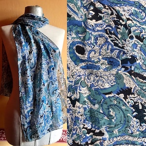Blue hues paisley, swirl printed 1970s vintage long silk scarf with hand rolled edges