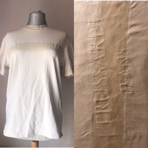 Trussardi 80's soft fabric T-shirt loose, comfy crew neck unisex blouse featuring company's logo with embossed lettering