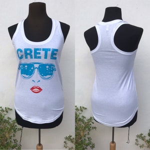 90s vintage touristic white tank top from the island of Crete with racer back features a girl’s face wearing big blue sunglasses