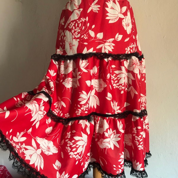 Gypsy styled vintage red floral full ruffled skirt with three tiered layers and black lace detailing from 1970