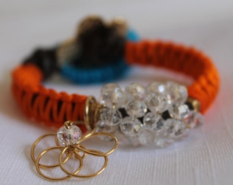 Leather  braided bracelet with crystals and gold field flower charm.