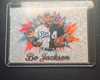 May include: A rectangular sports trading card featuring Bo Jackson in a split uniform design, wearing a Kansas City Royals baseball jersey on the left and a football jersey on the right. The background has colorful paint splatters and stars.