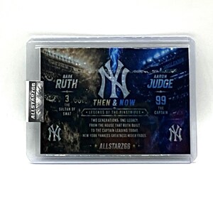 May include: A baseball trading card featuring Babe Ruth and Aaron Judge. The card has the text "THEN & NOW" and "LEGENDS OF THE PINSTRIPES". The card is in a protective sleeve with the "ALLSTARZ66" logo.