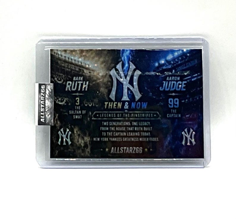 May include: A baseball trading card featuring Babe Ruth and Aaron Judge. The card has the text "THEN & NOW" and "LEGENDS OF THE PINSTRIPES". The card is in a protective sleeve with the "ALLSTARZ66" logo.