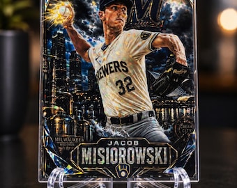May include: A rectangular baseball trading card featuring Jacob Misiorowski in a Milwaukee Brewers uniform, throwing a baseball against a dark city skyline background. The card includes the text Milwaukee, Wisconsin, Cream City, and the player's name.
