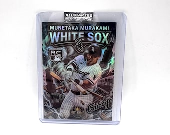May include: A baseball trading card featuring Munetaka Murakami of the Chicago White Sox. The card has a holographic design with the team logo and player's name. The card is encased in a protective plastic sleeve.