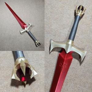 May include: A red and gold sword with a black handle and a red gem on the pommel. The sword has a decorative design on the blade and a cross guard.