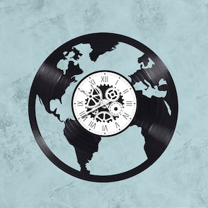 May include: A black vinyl record clock with a white clock face and gears. The clock face has Roman numerals and the record is shaped like a world map.