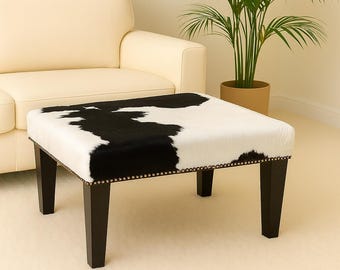 Poggiapiedi in pelle di mucca bianca e nera, gamba affusolata moderna, 316