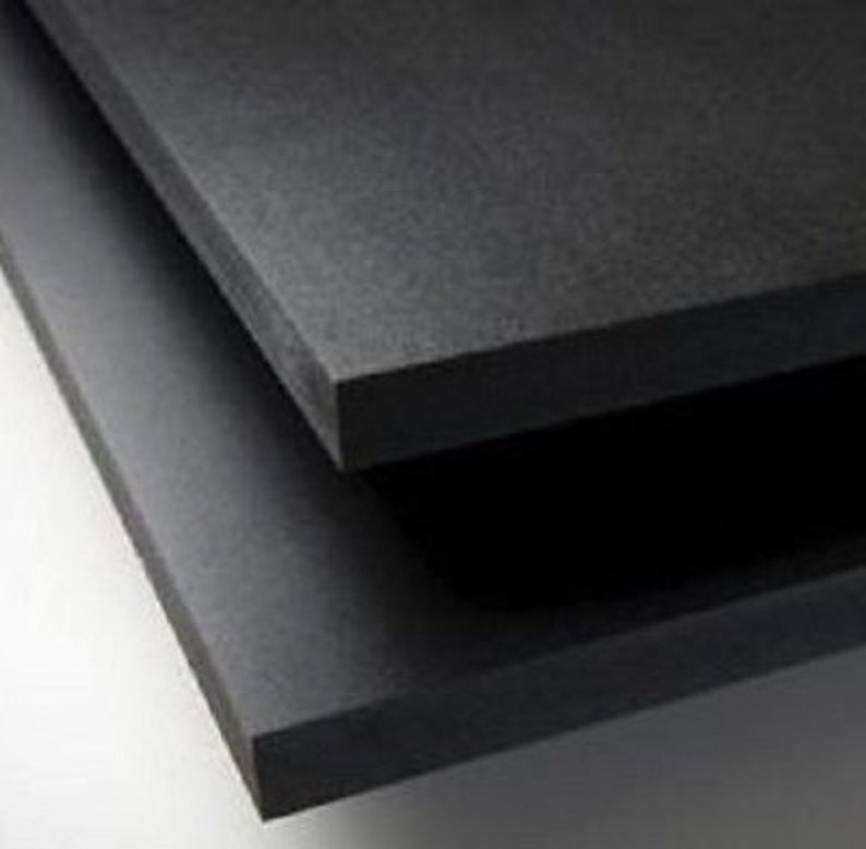 May include: Two black foam boards stacked on top of each other.