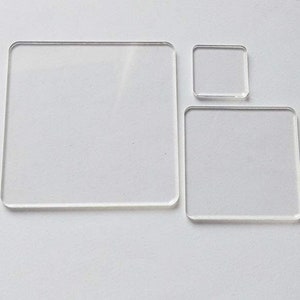 May include: Three clear acrylic squares of different sizes. The largest square is approximately 6 inches by 6 inches, the middle square is approximately 4 inches by 4 inches, and the smallest square is approximately 2 inches by 2 inches.