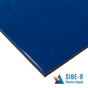 May include: A close-up of a solid blue sheet of plastic. The sheet is smooth and has a slight sheen. The sheet is cut at a 45-degree angle, revealing a black edge.
