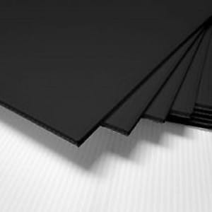 May include: Stack of black foam core sheets, a material used for crafts, model making, and display boards.