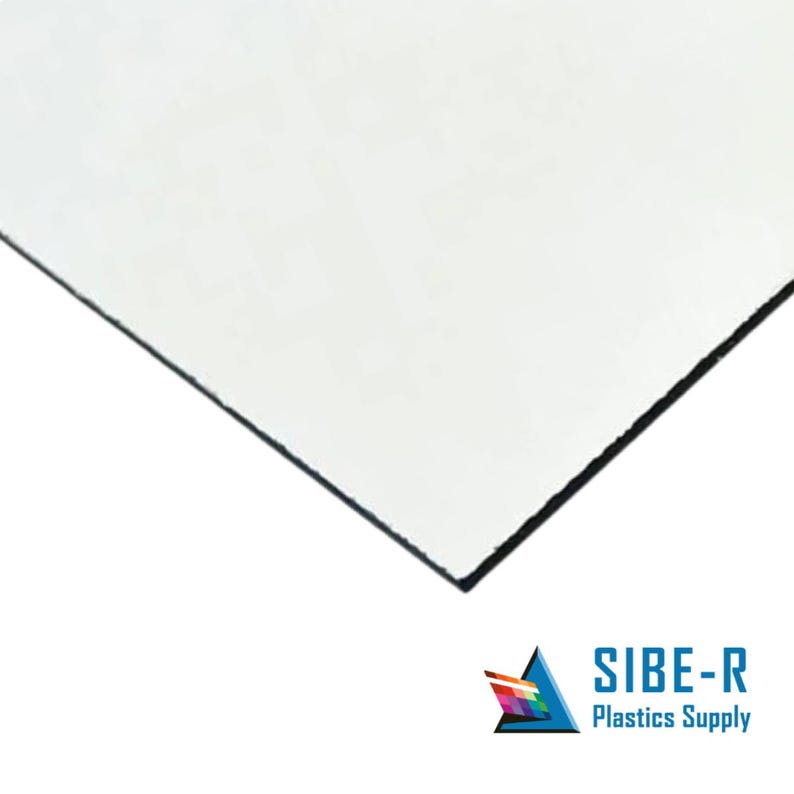 May include: A clear, white, rectangular sheet of plastic. The sheet is slightly curved at the edges.