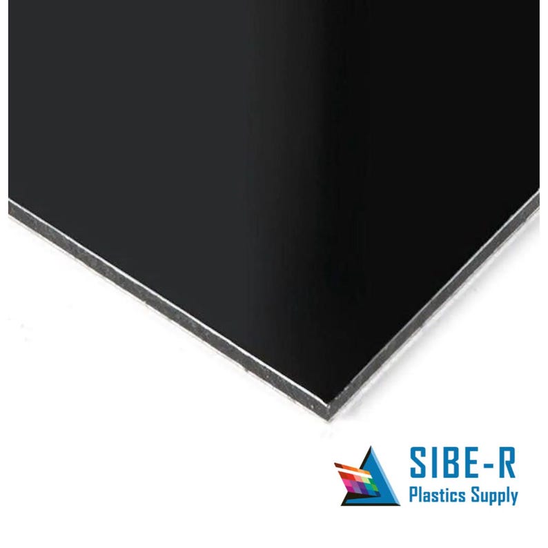 May include: A black sheet of dibond, a type of composite panel, with a smooth surface. The panel is made of two aluminium sheets bonded to a polyethylene core.