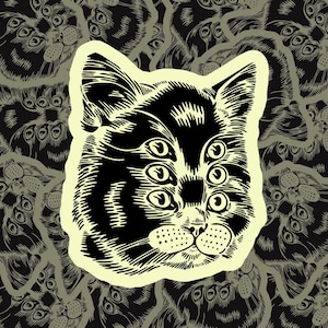May include: A black and white illustration of a cat with multiple eyes. The cat's face is surrounded by a pattern of smaller, similar cat faces.