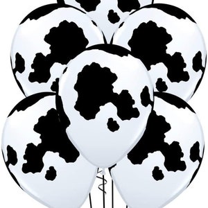 K&ouml;nnte beinhalten: Ein Set mit sechs schwarzen und wei&szlig;en Kuh-Druckballons. Die Ballons sind mit einem schwarzen Band zusammengebunden.