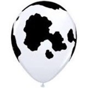 K&ouml;nnte beinhalten: Wei&szlig;er Ballon mit schwarzem Kuhmuster.