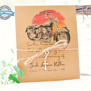 May include: A brown card with a motorcycle graphic and a sunset background. The card has the text "Scatter these seeds... in loving memory of Jack Alan Keller October 17, 1977 - November 1, 2020".