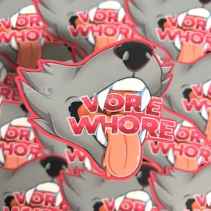 May include: A sticker featuring a cartoon wolf with an open mouth and tongue sticking out. The wolf's mouth is filled with pink hearts and the text "VORE WHORE" is written in pink letters.