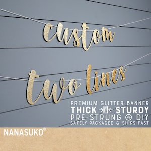May include: Gold glitter banner with the text "custom two lines" on a gray background. The banner is pre-strung and comes with a description that says "Premium Glitter Banner Thick Sturdy Pre-Strung DIY Safely Packaged & Ships Fast".