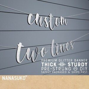May include: Silver glitter banner with the text "custom two times" on a gray wood background. The banner is pre-strung and comes with a thick, sturdy construction.  The banner is safely packaged and ships fast.