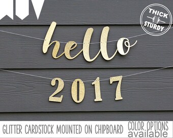 hello 2017 banner, happy new year 2017, two lines, glitter party decorations, cursive banner