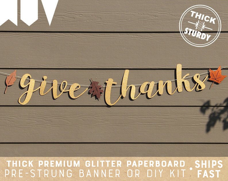May include: A gold glitter paperboard banner with the words "give thanks" and fall leaves. The banner is pre-strung and comes with a thick, sturdy construction.