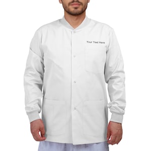 May include: White lab coat with a band collar, long sleeves, and three front pockets. The text "Your Text Here" is printed on the left chest pocket. The coat has a button-up front and ribbed cuffs.