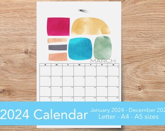 May include: A printable 2024 calendar with a colorful abstract design. The calendar is for the month of March and features a yellow, green, blue, pink, and gray design. The calendar is available in Letter, A4, and A5 sizes.