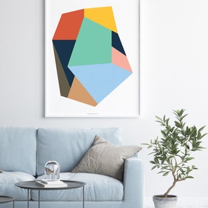 May include: Abstract geometric art print featuring a multi-colored, irregular shape with shades of blue, green, yellow, orange, pink, brown, and black.