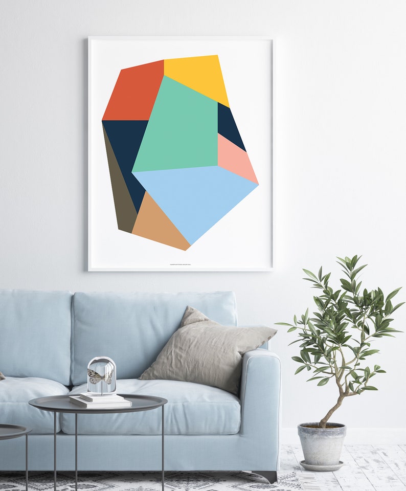 May include: Abstract geometric art print featuring a multi-colored, irregular shape with shades of blue, green, yellow, orange, pink, brown, and black.