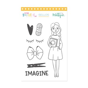 May include: A set of black and white digital stamps featuring a girl holding a book, a bow, a heart, eyelashes, yarn, and a clothespin. The text "IMAGINE" is included in the image.