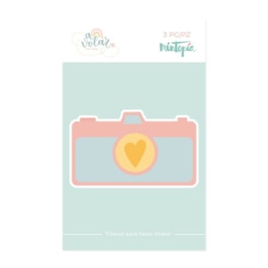 May include: A pink and blue camera die cut with a yellow heart in the viewfinder. The die cut is for making shaker cards. The text "3 PC/PZ Mintopia" is at the top of the image. The text "Troquel para hacer shaker" is at the bottom of the image.
