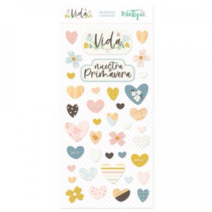 May include: A sheet of 39 colorful heart-shaped stickers with various patterns and designs. The stickers feature the words "Vida", "nuestra primavera", "hola", "feliz", and "amor".
