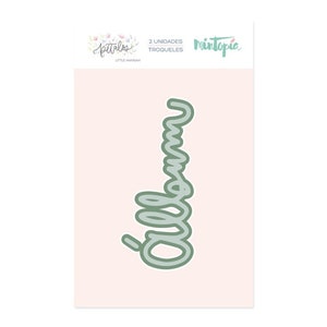 May include: A die cut for a craft project, featuring the word "mama" in a cursive script style. The die cut is green and is on a pink background. The text "2 UNIDADES TROQUELES" and "Mintopia" are also visible on the image.