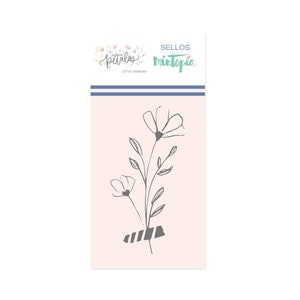 May include: A black and white line drawing of a bouquet of flowers with a striped band at the bottom. The image is on a pink background with the text "SELLOS MINTOPIA LITTLE HANNAH" at the top.
