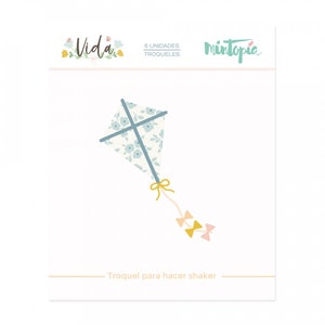 May include: A blue and white patterned kite with a yellow string and two pink bows. The text "Troquel para hacer shaker" is below the kite.